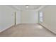 Spacious main bedroom with tray ceiling and ample natural light at 5135 Gable Ridge Way, Sugar Hill, GA 30518