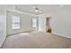 Spacious main bedroom with tray ceiling and ample natural light at 5135 Gable Ridge Way, Sugar Hill, GA 30518