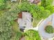 An aerial view showcases the home's roof, landscaping, and proximity to neighborhood cul-de-sac at 515 Old Chartwell Xing, Alpharetta, GA 30022
