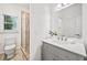 Modern bathroom featuring a glass shower and sleek vanity with a large mirror and updated fixtures at 515 Old Chartwell Xing, Alpharetta, GA 30022