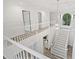 Spacious foyer featuring an open staircase with white railings and modern chandelier at 515 Old Chartwell Xing, Alpharetta, GA 30022