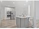 Bright kitchen features a center island and modern stainless steel appliances and fixtures at 515 Old Chartwell Xing, Alpharetta, GA 30022