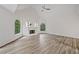 Spacious living room boasts hardwood floors, a fireplace, and abundant natural light at 515 Old Chartwell Xing, Alpharetta, GA 30022