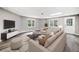 Cozy basement living room with plush seating, and ample natural light at 515 Old Chartwell Xing, Alpharetta, GA 30022