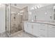 Contemporary main bath featuring a glass shower and stylish vanity with granite countertops at 515 Old Chartwell Xing, Alpharetta, GA 30022