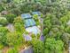 Aerial view of community tennis courts and pool area, perfect for recreation and social activities at 515 Old Chartwell Xing, Alpharetta, GA 30022