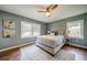 Relaxing main bedroom featuring large windows and hardwood floors at 1399 Pollard Sw Dr, Atlanta, GA 30311