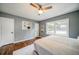Cozy bedroom featuring hardwood floors and ample natural light at 1399 Pollard Sw Dr, Atlanta, GA 30311