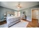 Comfortable bedroom with hardwood flooring and a ceiling fan at 1399 Pollard Sw Dr, Atlanta, GA 30311