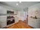 Updated kitchen featuring granite countertops, and stainless steel appliances at 1399 Pollard Sw Dr, Atlanta, GA 30311