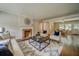 Comfortable living room with fireplace, hardwood floors, and views of the dining room at 1399 Pollard Sw Dr, Atlanta, GA 30311