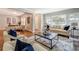 Bright living room with fireplace, hardwood floors, and large windows connected to office area at 1399 Pollard Sw Dr, Atlanta, GA 30311