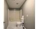 A clean bathroom featuring a tub-shower combination and a standard white toilet at 208 Holiday Way, Carrollton, GA 30116