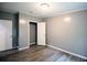 This bedroom features modern gray walls, light wood floors, and bright lighting at 208 Holiday Way, Carrollton, GA 30116