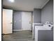 This laundry room has updated gray walls, light wood floors and modern appliances at 208 Holiday Way, Carrollton, GA 30116
