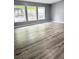 This living room offers modern light wood floors and plenty of natural light at 208 Holiday Way, Carrollton, GA 30116