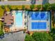 Aerial view features a community pool, tennis courts, clubhouse, and parking at 4215 Idlewood Dr, Cumming, GA 30040