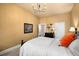 Well-lit bedroom with a plush bed, dresser, natural light, and stylish decor at 4215 Idlewood Dr, Cumming, GA 30040