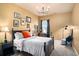 Cozy bedroom with a plush bed, dresser, natural light, and stylish decor at 4215 Idlewood Dr, Cumming, GA 30040