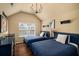 Bright bedroom features hardwood floors, vaulted ceiling, and two twin beds at 4215 Idlewood Dr, Cumming, GA 30040