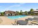 Community pool and clubhouse with lounge chairs, patio seating, and shade umbrellas at 4215 Idlewood Dr, Cumming, GA 30040