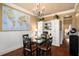 Charming dining area with dark wood flooring, and custom lighting at 4215 Idlewood Dr, Cumming, GA 30040