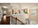 Elegant entryway boasting hardwood floors, natural light, and a stylish staircase leading to the upper level at 4215 Idlewood Dr, Cumming, GA 30040