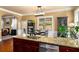 Open kitchen with granite countertops, stainless steel appliances, and plenty of natural light at 4215 Idlewood Dr, Cumming, GA 30040
