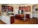 Modern kitchen with granite counters, stainless steel appliances and an eat-in island at 4215 Idlewood Dr, Cumming, GA 30040