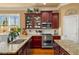 Well-lit kitchen featuring granite countertops, stainless steel appliances, and ample counter space at 4215 Idlewood Dr, Cumming, GA 30040