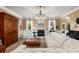 Comfortable living room with a fireplace, large sofa, and elegant decor at 4215 Idlewood Dr, Cumming, GA 30040