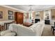 Inviting living room with a fireplace, large sofa, and neutral decor at 4215 Idlewood Dr, Cumming, GA 30040
