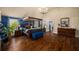 Spacious main bedroom featuring a canopy bed, sitting area, and ample natural light from the windows at 4215 Idlewood Dr, Cumming, GA 30040