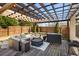 Outdoor patio with pergola, comfortable seating, and fenced yard at 4215 Idlewood Dr, Cumming, GA 30040
