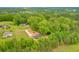 Aerial view of a gray single-story house surrounded by lush green trees at 4901 Prince Se Rd, Smyrna, GA 30082