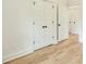 Bedroom featuring hardwood floors and doors leading to connecting rooms and closet at 4901 Prince Se Rd, Smyrna, GA 30082