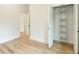 Bedroom with hardwood floors, white walls, a closet and a connecting door to another room at 4901 Prince Se Rd, Smyrna, GA 30082