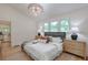 Bright bedroom with large windows, a cozy rug, and stylish wood nightstands at 4901 Prince Se Rd, Smyrna, GA 30082