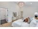 Cozy bedroom featuring a modern light fixture, white walls, and stylish nightstands at 4901 Prince Se Rd, Smyrna, GA 30082