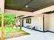 View under carport showing exterior facade, front door, and landscaping at 4901 Prince Se Rd, Smyrna, GA 30082