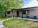 Charming single-story home with a walkway leading to the covered front door at 4901 Prince Se Rd, Smyrna, GA 30082