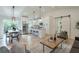 Open-concept living area with hardwood floors, modern lighting, and an adjacent kitchen at 4901 Prince Se Rd, Smyrna, GA 30082