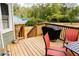 Back porch with a grill and outdoor seating with a view of the green backyard at 114 Summer Glen Pl, Dallas, GA 30157