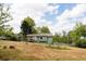 Picture of home with expansive backyard space, and a partial view of a wooden porch at 114 Summer Glen Pl, Dallas, GA 30157