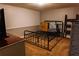 Bedroom with a metal frame bed, neutral wall colors, and cozy carpeting, offering a comfortable retreat at 114 Summer Glen Pl, Dallas, GA 30157