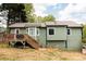Picture of the back of the house that highlights a large outdoor patio/deck at 114 Summer Glen Pl, Dallas, GA 30157