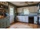 Bright kitchen featuring white cabinets and wood flooring at 114 Summer Glen Pl, Dallas, GA 30157