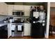 Functional kitchen featuring white cabinets, stainless steel appliances, and a gas range at 114 Summer Glen Pl, Dallas, GA 30157
