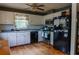 Well-lit kitchen with white cabinetry and stainless steel appliances at 114 Summer Glen Pl, Dallas, GA 30157