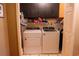 Convenient laundry room with washer, dryer, and overhead cabinets for storage at 114 Summer Glen Pl, Dallas, GA 30157